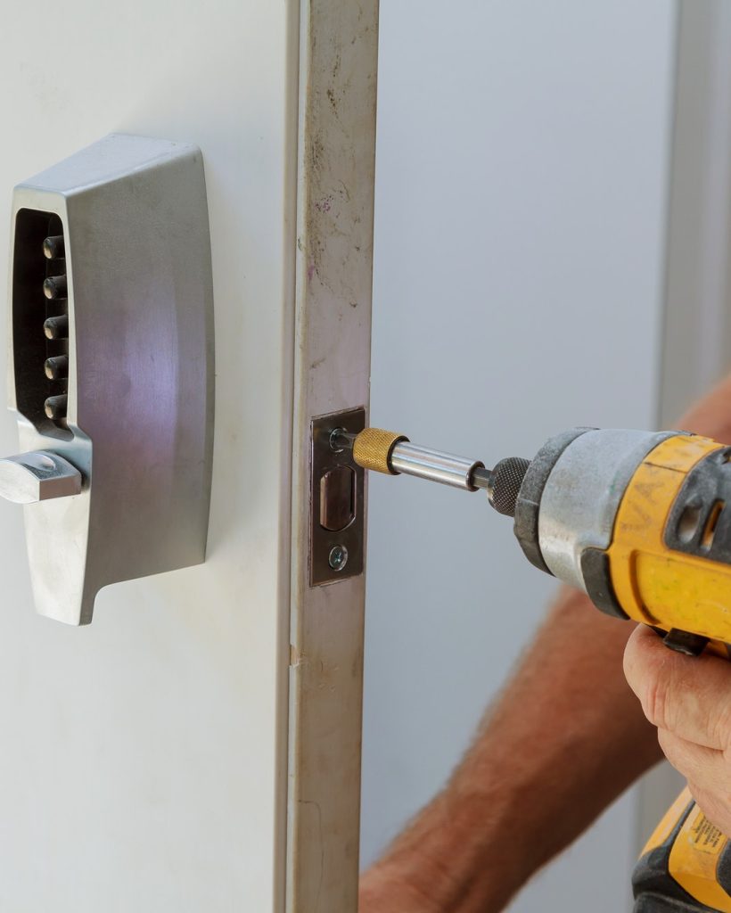 man-installing-of-the-door-with-lock-key-security.jpg